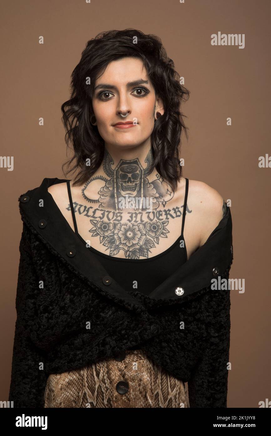 Portrait of confident transgender woman with chest tattoo Stock Photo