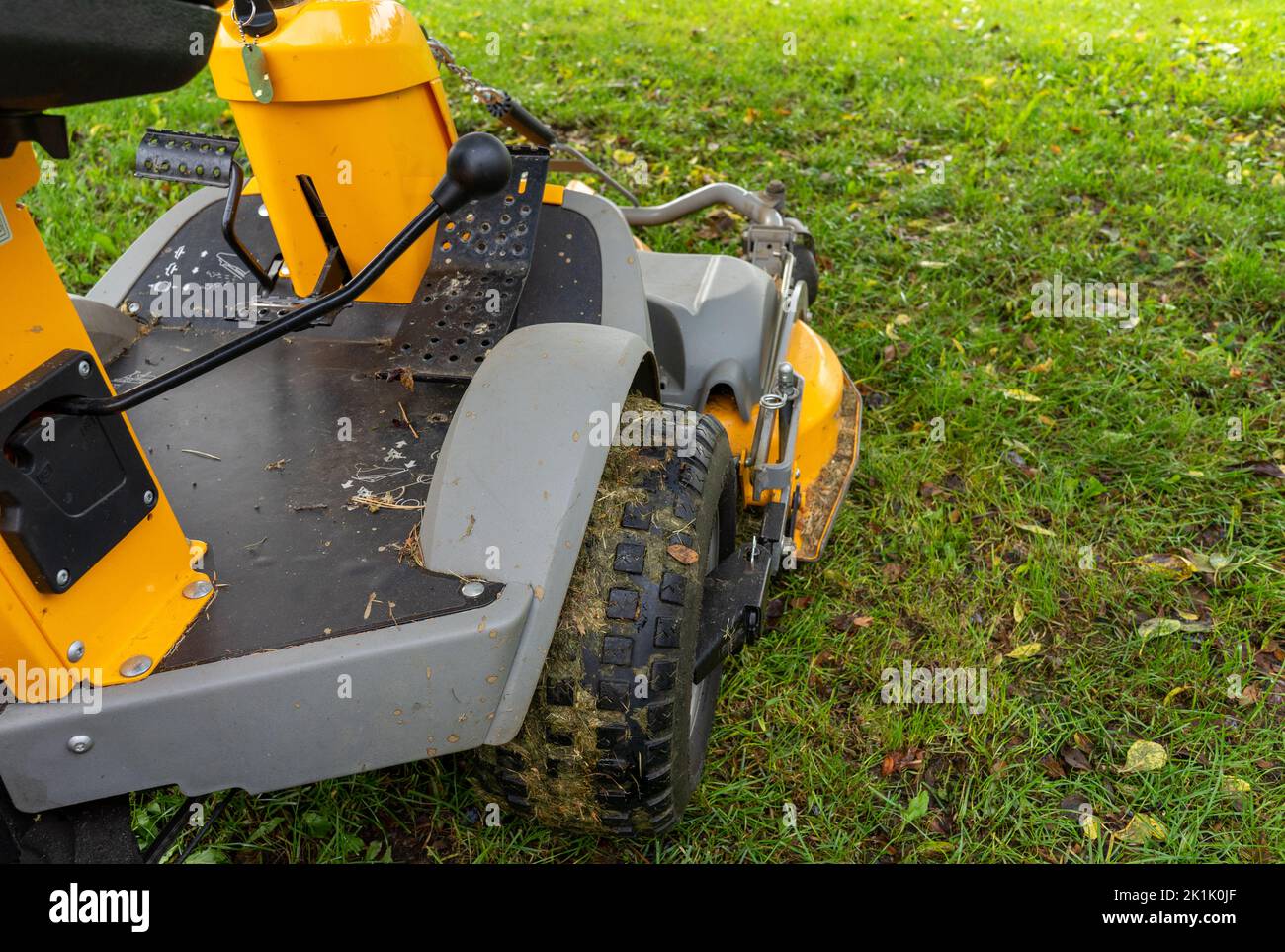 Mowing the lawn with a tractor Stock Photo