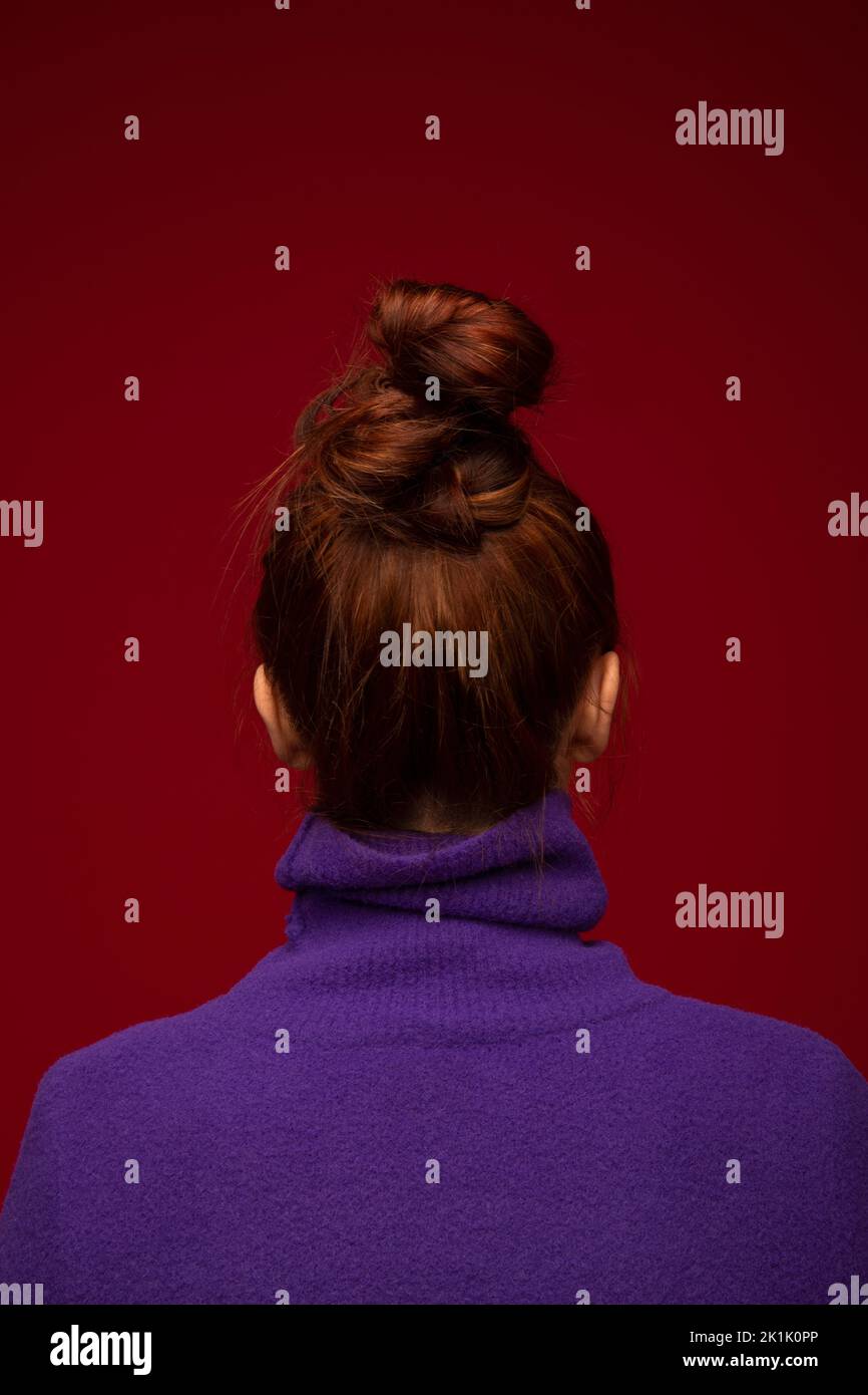 Portrait of redhead teenage girl in purple turtleneck Stock Photo