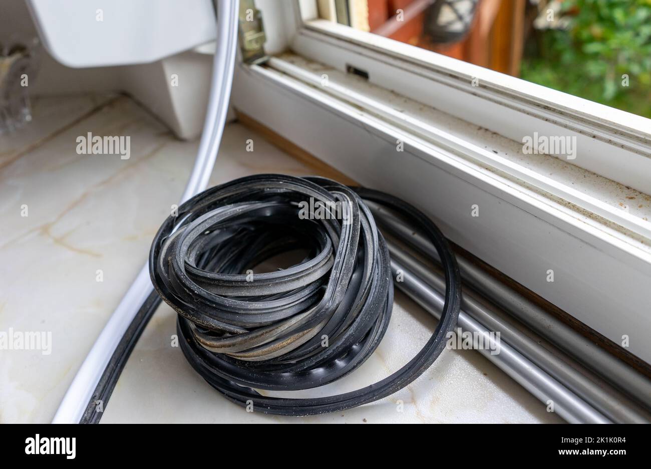 Sealing a window with sealing rubber Stock Photo