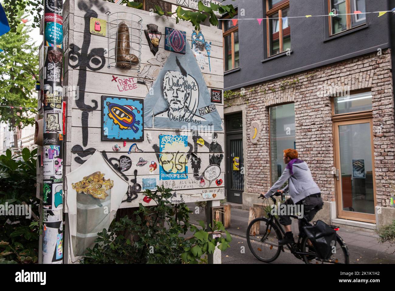 the Koernerfeld Gallery for Street Art in Koerner street in the Ehrenfeld district of Cologne, Germany. Artists can exhibit their work on the wooden c Stock Photo