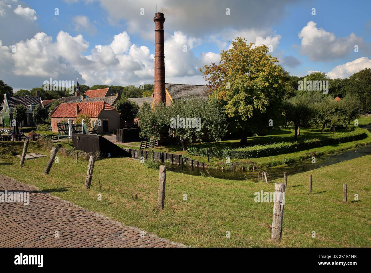 ENKHUIZEN, NETHERLANDS - SEPTEMBER 11, 2022: Zuiderzeemuseum, an open air museum on the shore of Ijsselmeer, with traditional cottages and a chimney Stock Photo