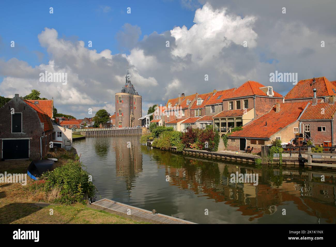 The historic center of Enkhuizen, West Friesland, Netherlands, with historic houses and the Drommedaris Gate Tower (dated from 1540) Stock Photo