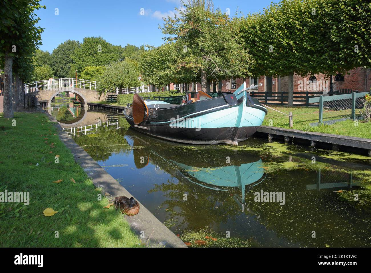 ENKHUIZEN, NETHERLANDS - SEPTEMBER 11, 2022: Zuiderzeemuseum, an open air museum on the shore of Ijsselmeer, with canals, boats and bridges Stock Photo