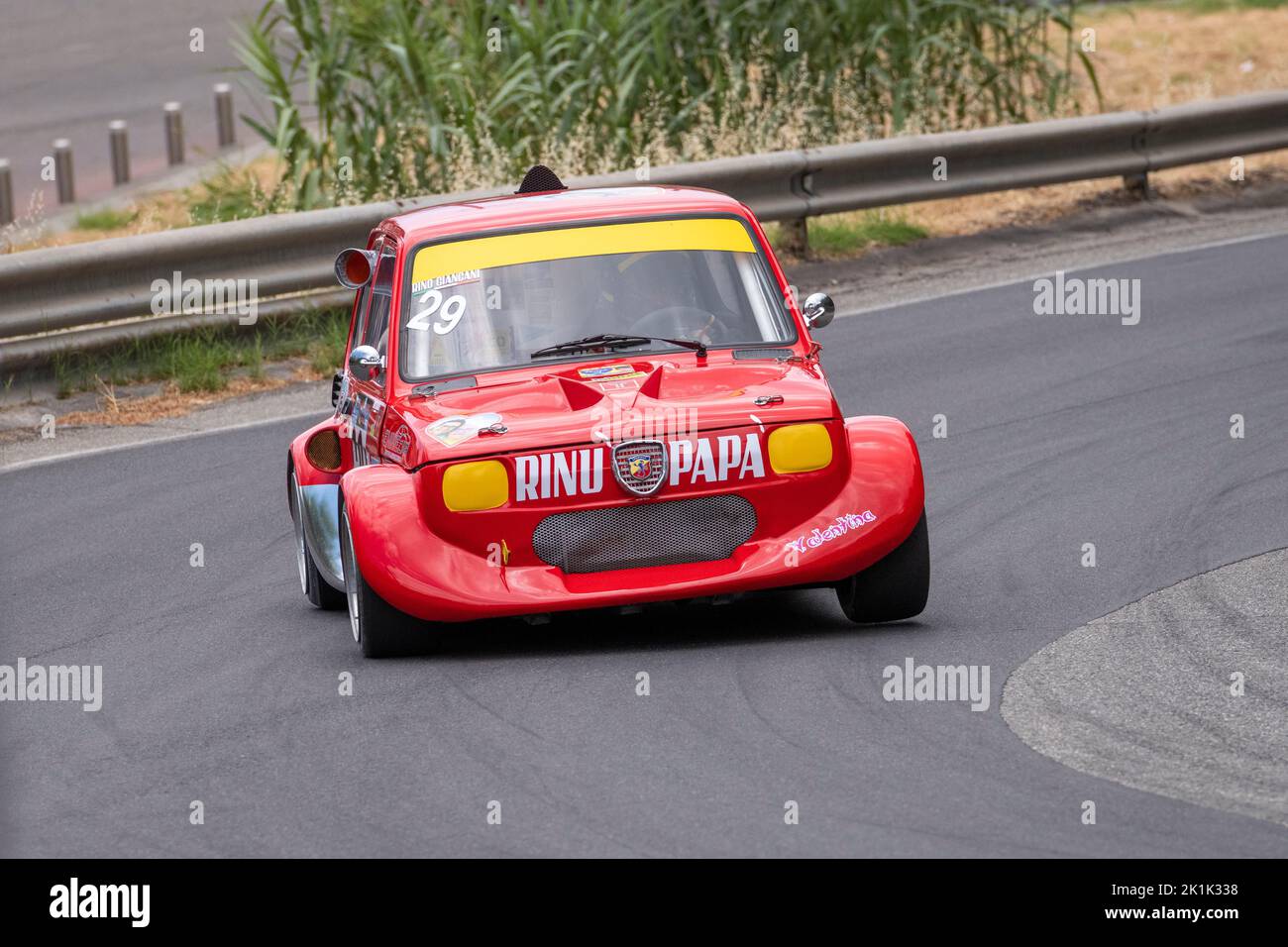 A Fiat 500 cornering hard during the 2022 Giarre-Milo hill climb on Mount Etna, Sicily, Italy Stock Photo