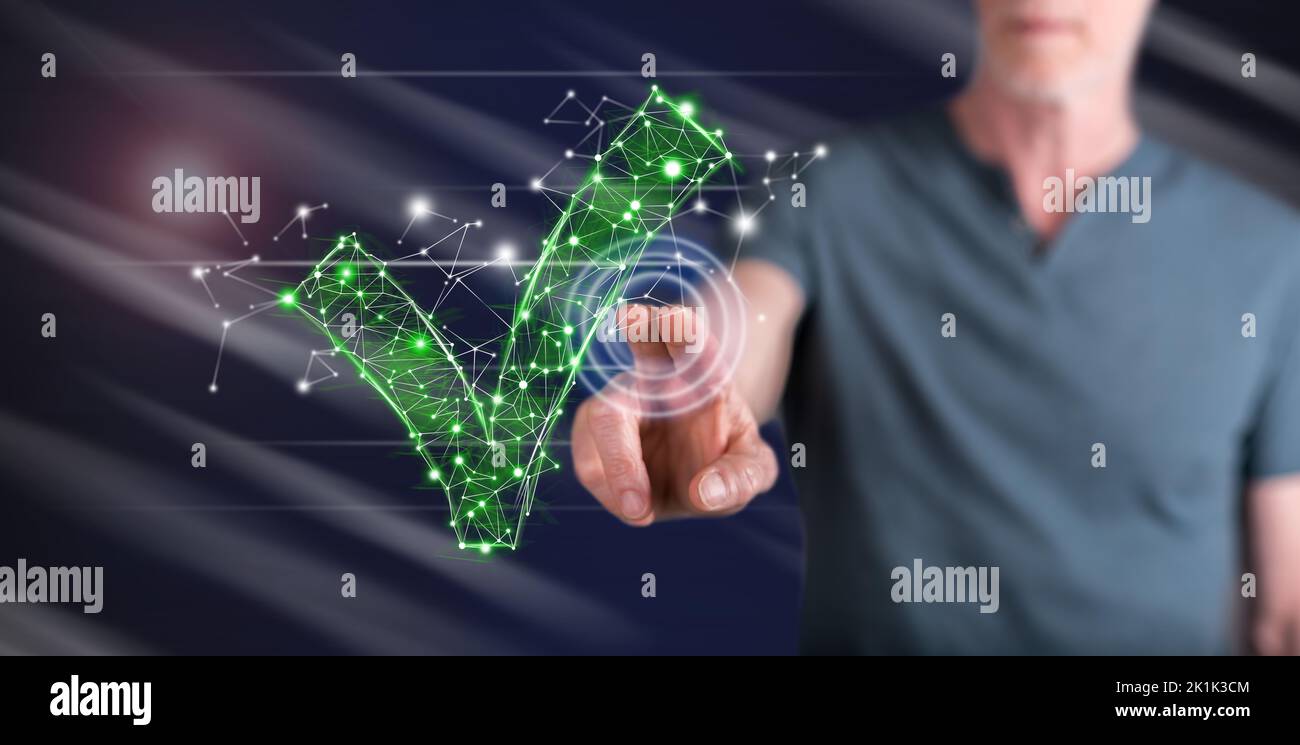 Man touching a validation concept on a touch screen with his finger Stock Photo