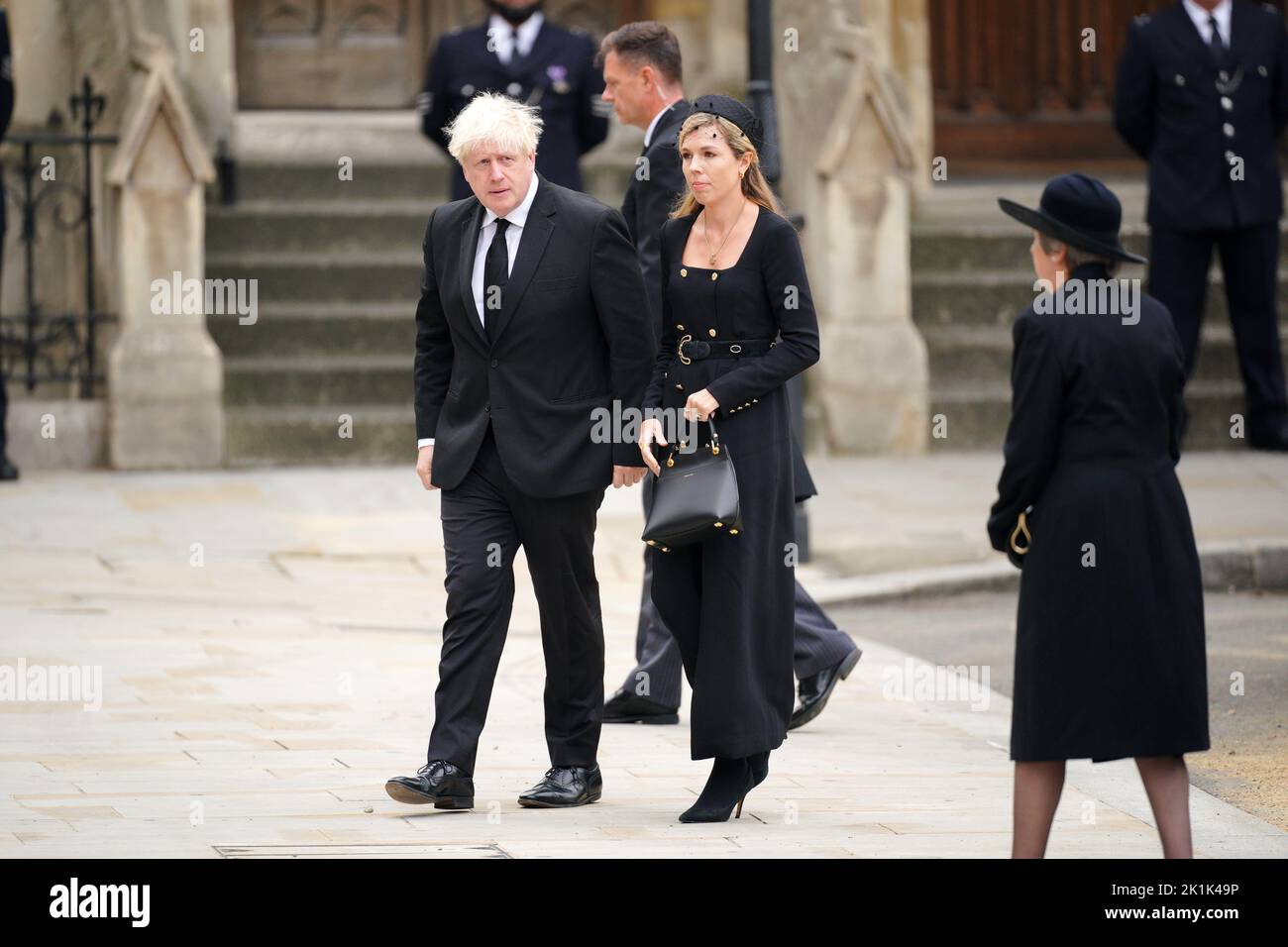 Former prime ministers Theresa May (right) and Boris Johnson with his wife Carrie Johnson arriving at the State Funeral of Queen Elizabeth II, held at Westminster Abbey, London. Picture date: Monday September 19, 2022. Stock Photo