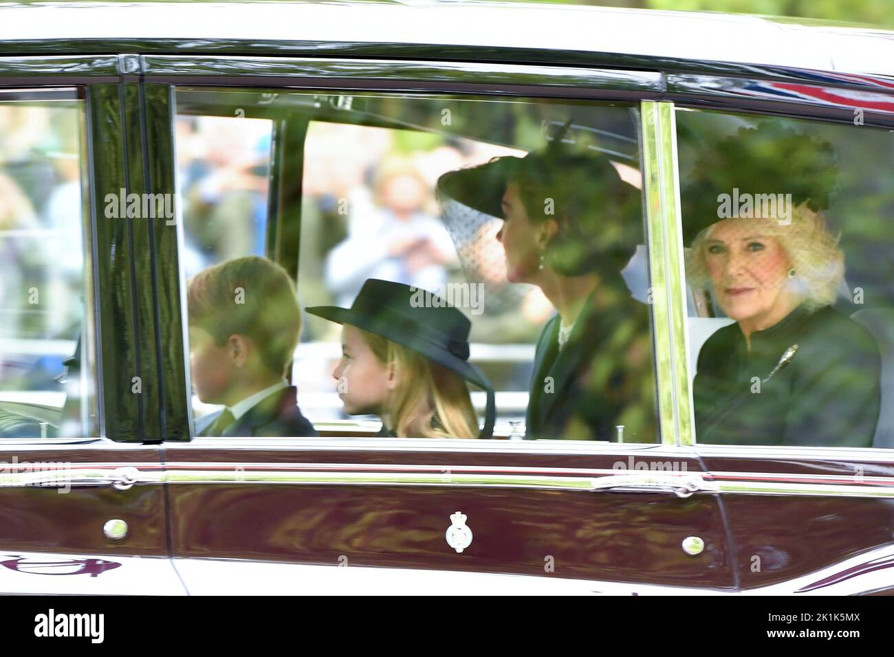 Princess Charlotte, Prince George, the Princess of Wales and the Queen Consort are seen on The Mall, central London arriving for Queen Elizabeth II state funeral on Monday. Picture date: Monday September 19, 2022. Stock Photo