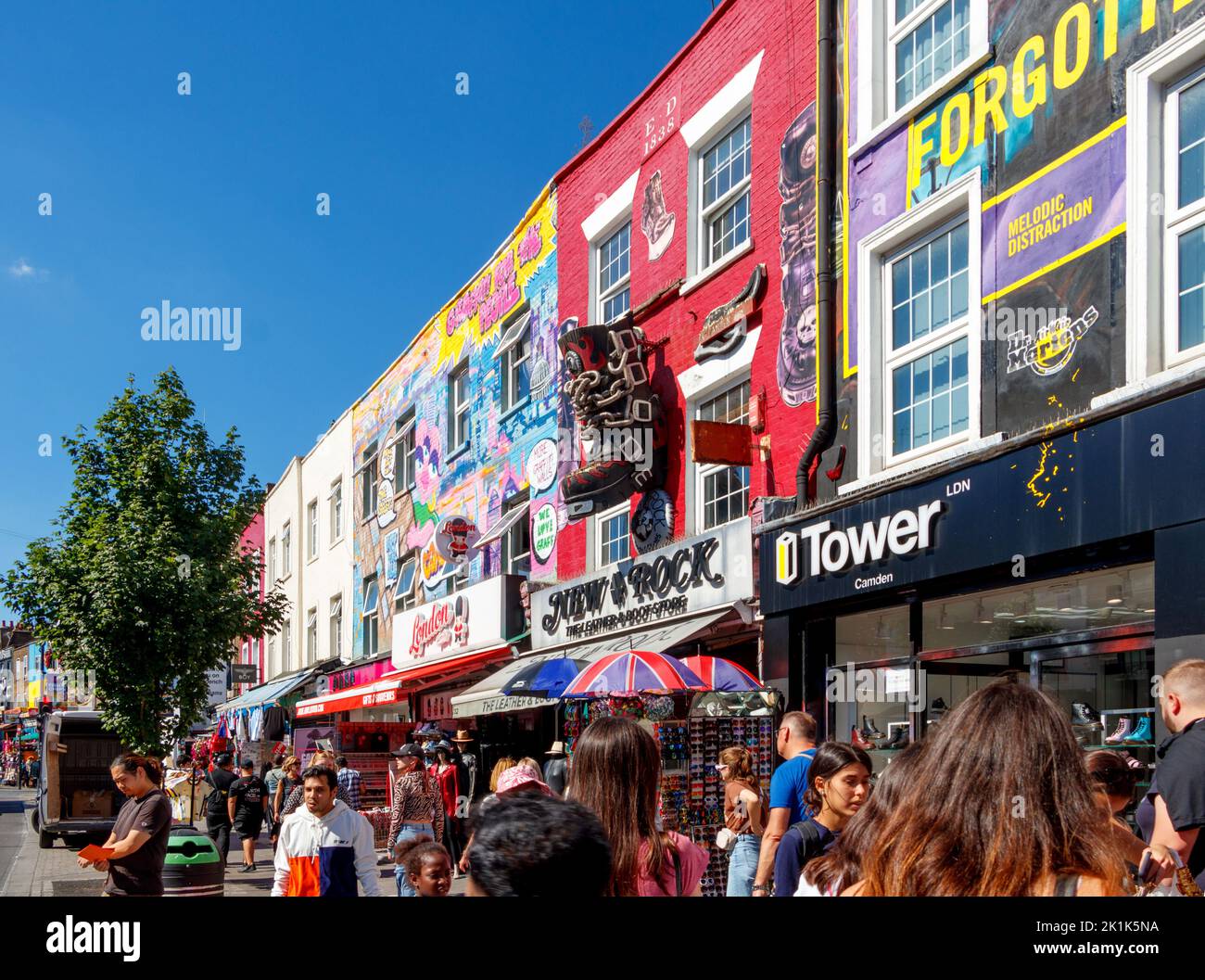 wall paintings on gift and shoe stores shops in camden high street camden town london uk Stock