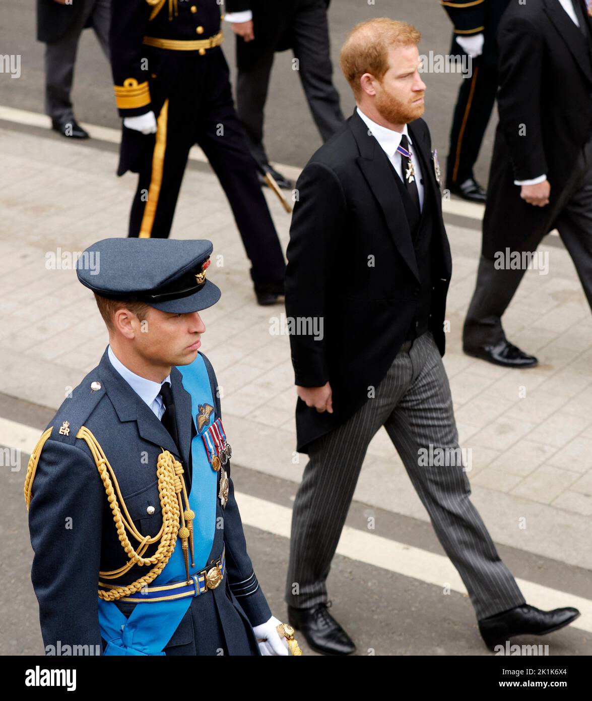 Britain's William, Prince of Wales and Britain's Prince Harry, Duke of Sussex, walk to Westminster Abbey on the day of the state funeral and burial of Britain's Queen Elizabeth, in London, Britain, September 19, 2022 REUTERS/John Sibley Stock Photo