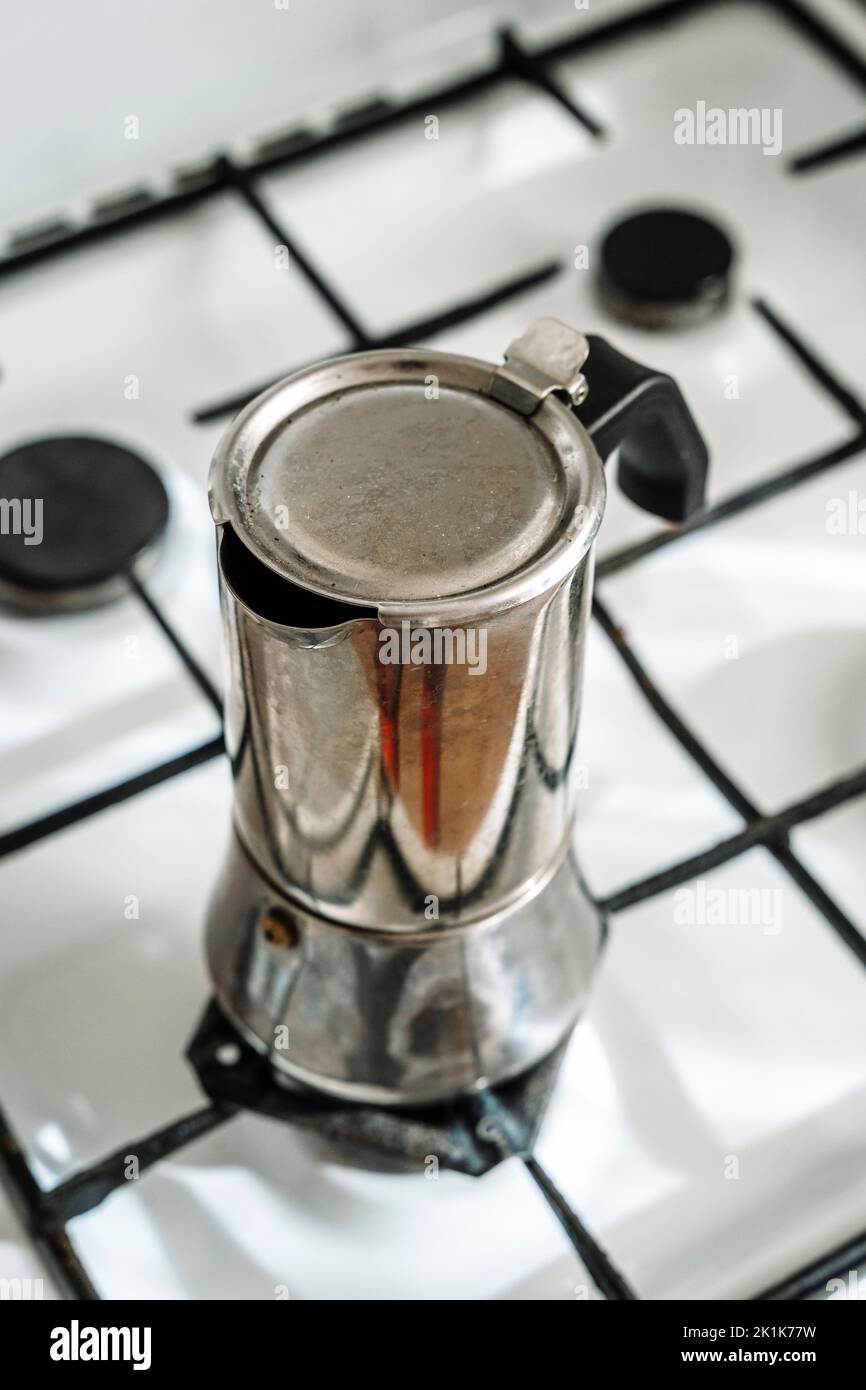 Metal coffee maker for brewing espresso coffee on the stove. Alternative brewing methods. High quality photo Stock Photo