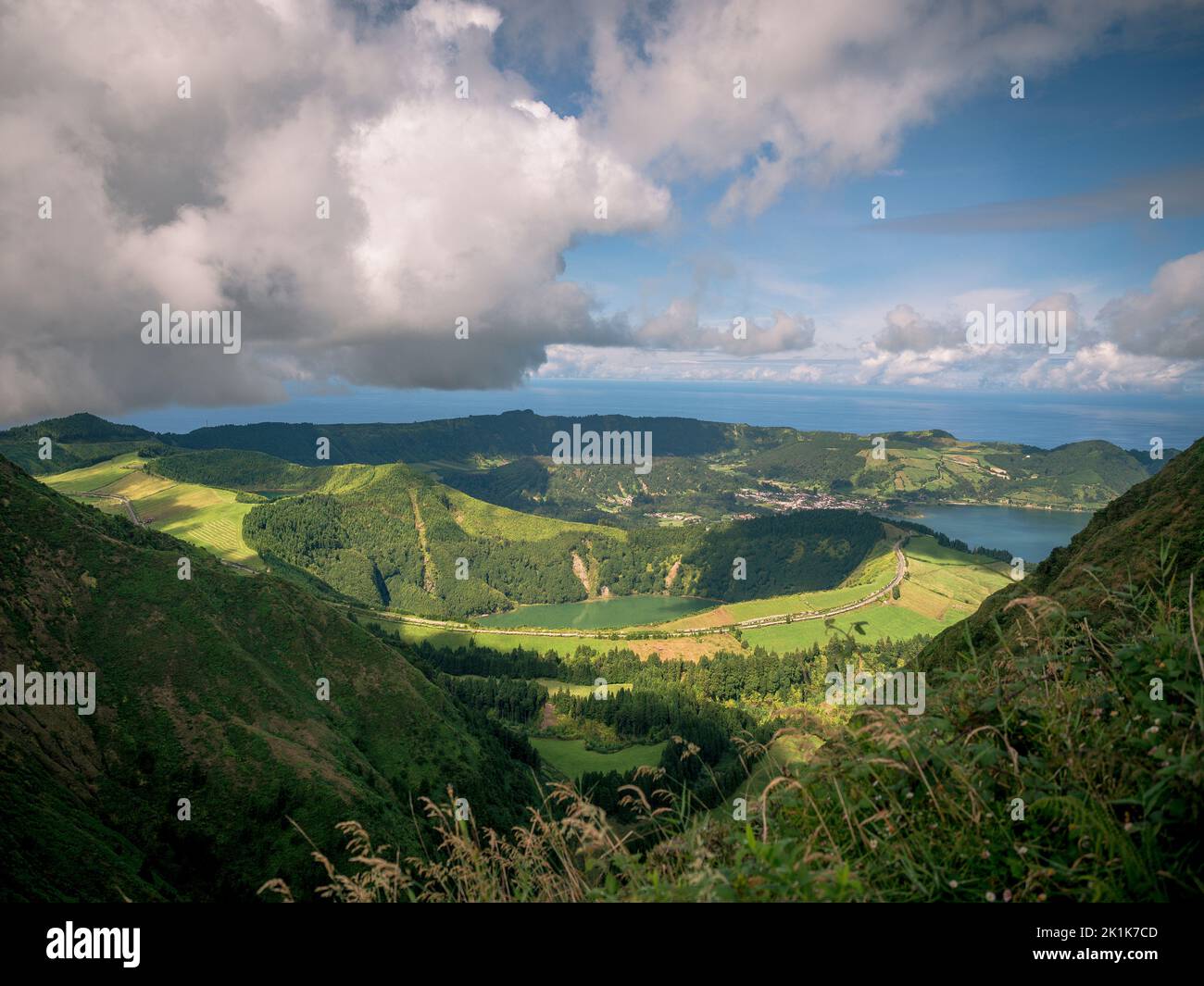 Rugged coastline of the Portuguese Azores islands in the Atlantic ocean. The islands are lined with lush rain forests and rugged volcanic rocks. Stock Photo
