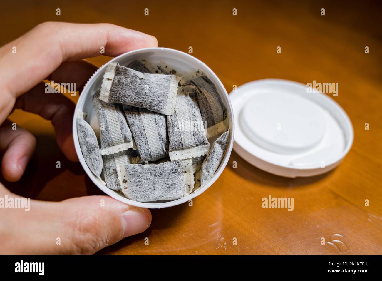 Snus, moist powder tobacco product , closeup vertical image with no label box Stock Photo Alamy