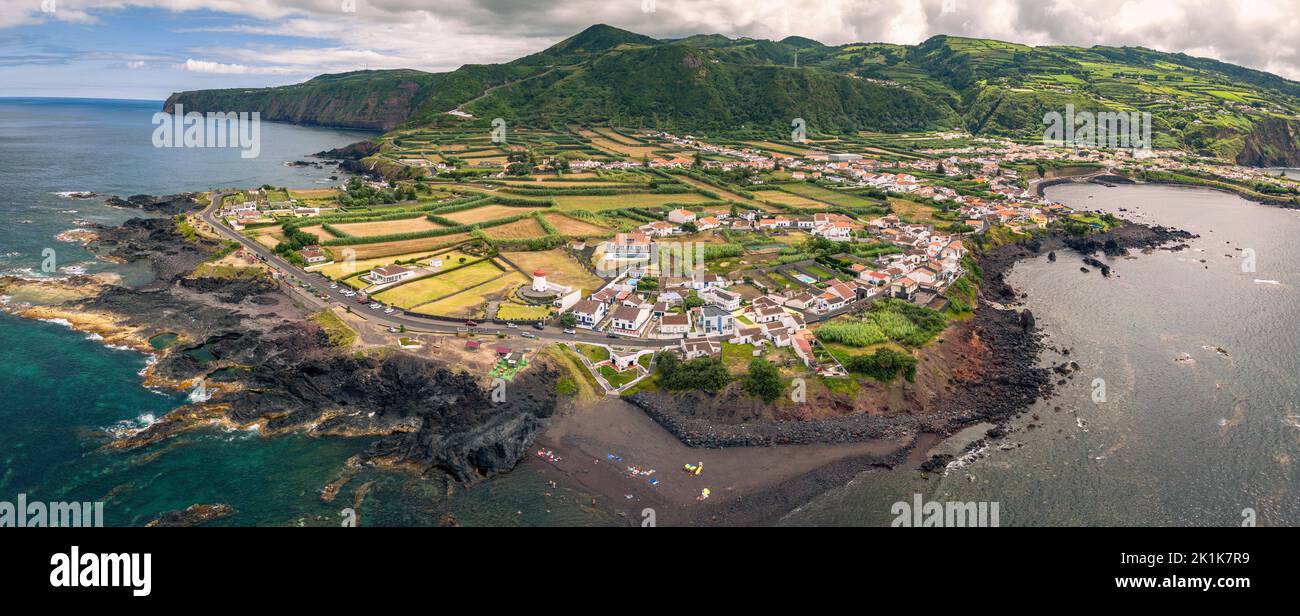 Rugged coastline of the Portuguese Azores islands in the Atlantic ocean. The islands are lined with lush rain forests and rugged volcanic rocks. Stock Photo