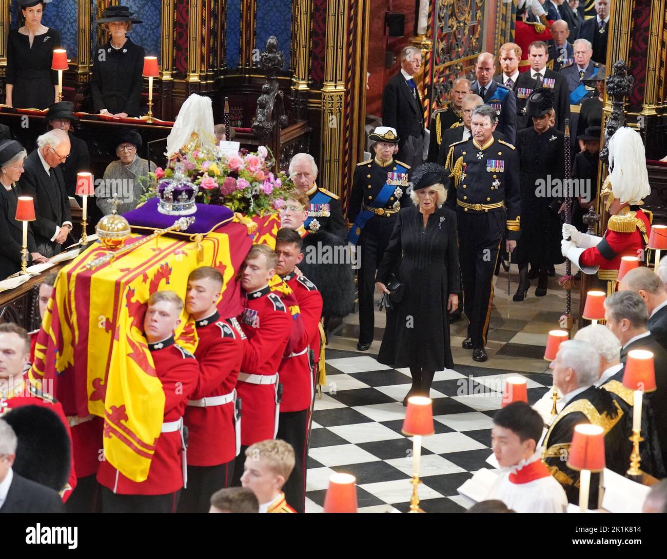 The coffin of Queen Elizabeth II is carried into Westminster Abbey, followed by King Charles III, the Queen Consort, the Princess Royal, Vice Admiral Sir Tim Laurence, the Duke of York, the Earl of Wessex, the Countess of Wessex, the Prince of Wales, the Princess of Wales, Prince George, Princess Charlotte, the Duke of Sussex, the Duchess of Sussex and Peter Phillips, for her State Funeral at the Abbey in London. Picture date: Monday September 19, 2022. Stock Photo