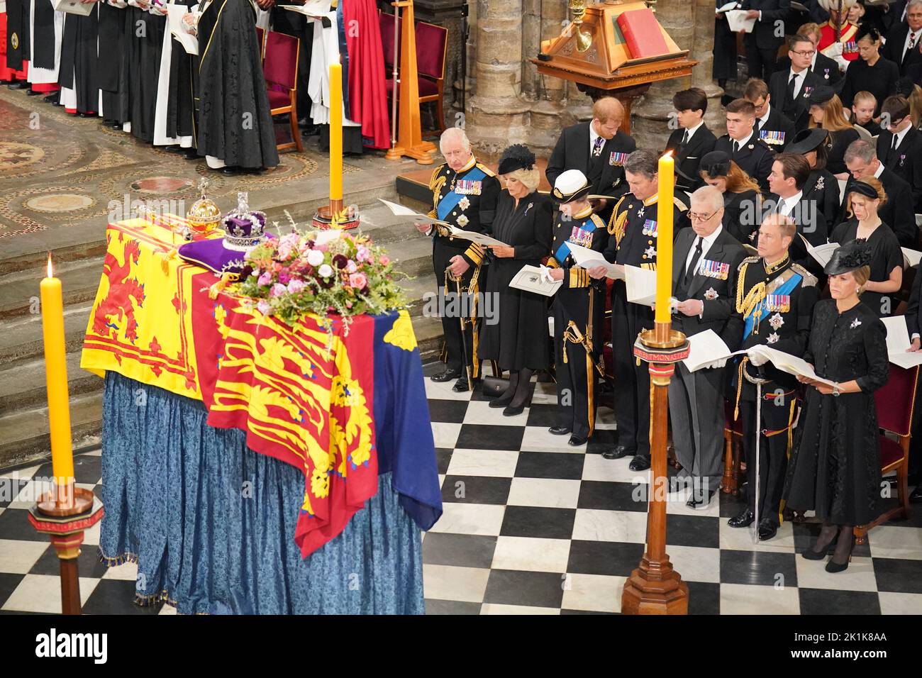 (front row) King Charles III, the Queen Consort, the Princess Royal, Vice Admiral Sir Tim Laurence, the Duke of York, the Earl of Wessex, the Countess of Wessex, (second row) the Duke of Sussex, the Duchess of Sussex, Princess Beatrice, Edoardo Mapelli Mozzi and Lady Louise Windsor, and (third row) Samuel Chatto, Arthur Chatto, Lady Sarah Chatto and Daniel Chatto in front of the coffin of Queen Elizabeth II during her State Funeral at the Abbey in London. Picture date: Monday September 19, 2022. Stock Photo