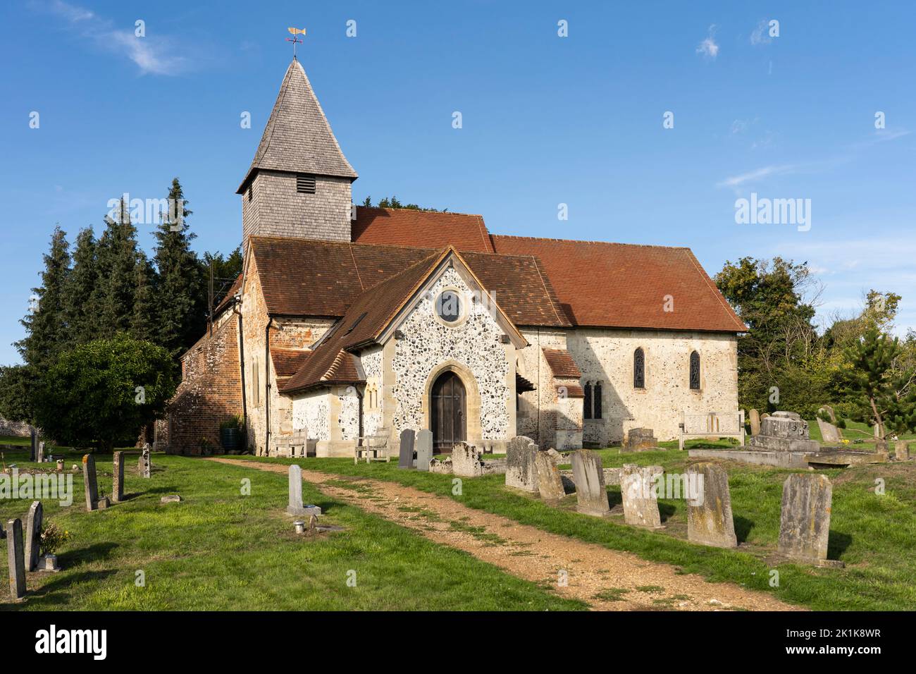 St Mary the Virgin, a 12th-century country church with a wooden belfrey standing inside the ancient walls of Silchester Roman city. Hampshire, UK Stock Photo