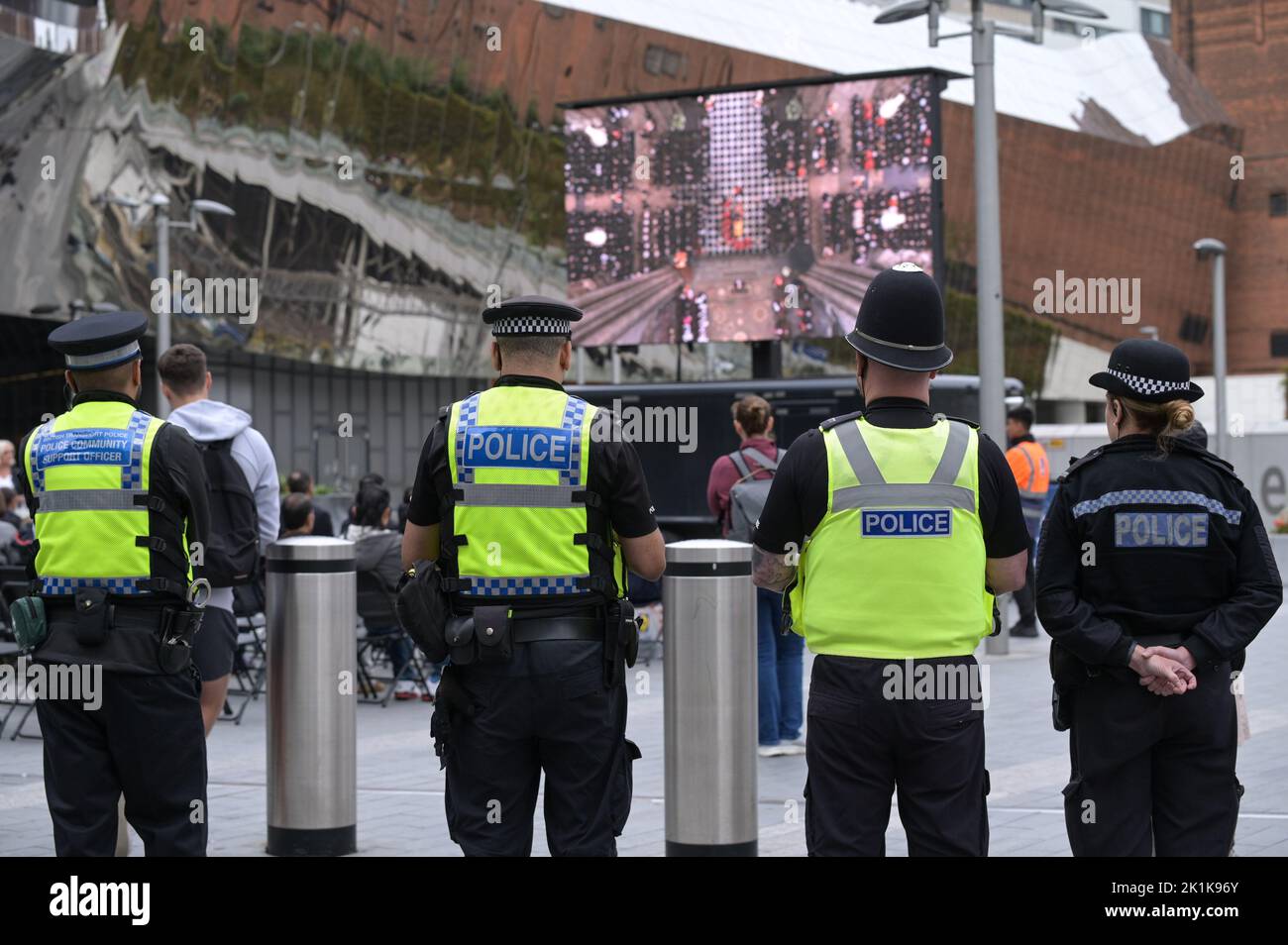 Birmingham New Street Station - September 19th 2022 - British Transport Police and West Midlands Police officers stand and watch crowds and the Queen's state funeral on a big screen outside Birmingham's New Street Station Credit: Scott CM/Alamy Live News Stock Photo
