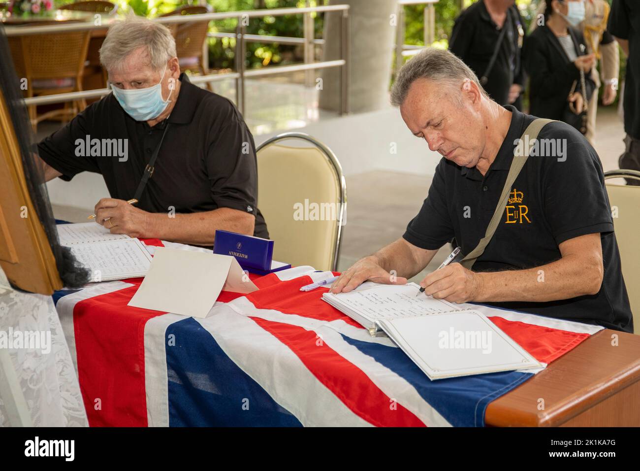 Pattaya, Thailand. 19th Sep, 2022. Participants sign the condolence book during a special commemoration service marking the death of Her Late Majesty Queen Elizabeth II at the Mahatai Convention Center Father Rays Foundation on September 19, 2022 in PATTAYA, THAILAND (Photo by Peter van der KloosterAlamy Live News) Credit: peter Van der Klooster/Alamy Live News Stock Photo