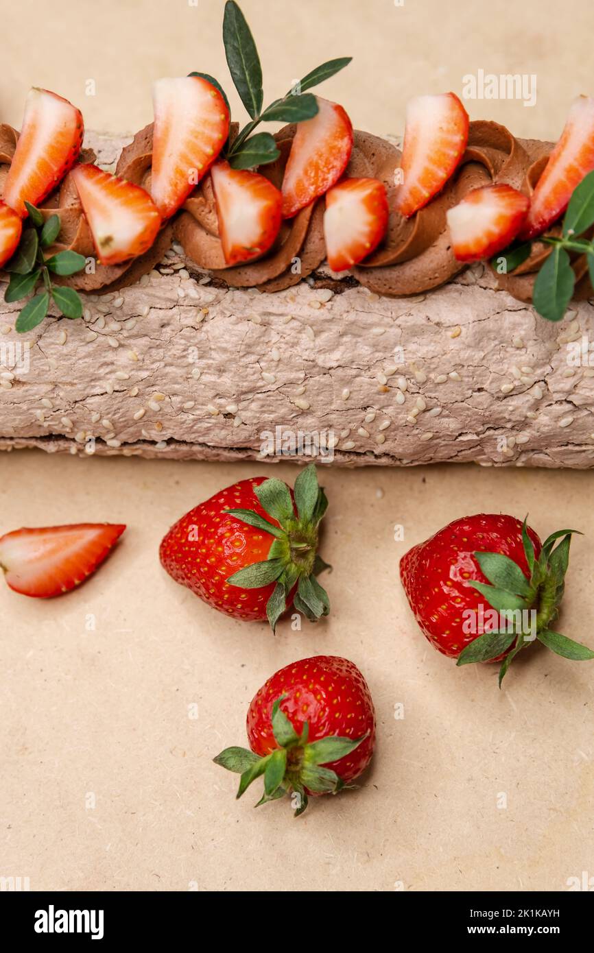 Chocolate roll with strawberries. Swiss roll cake Stock Photo