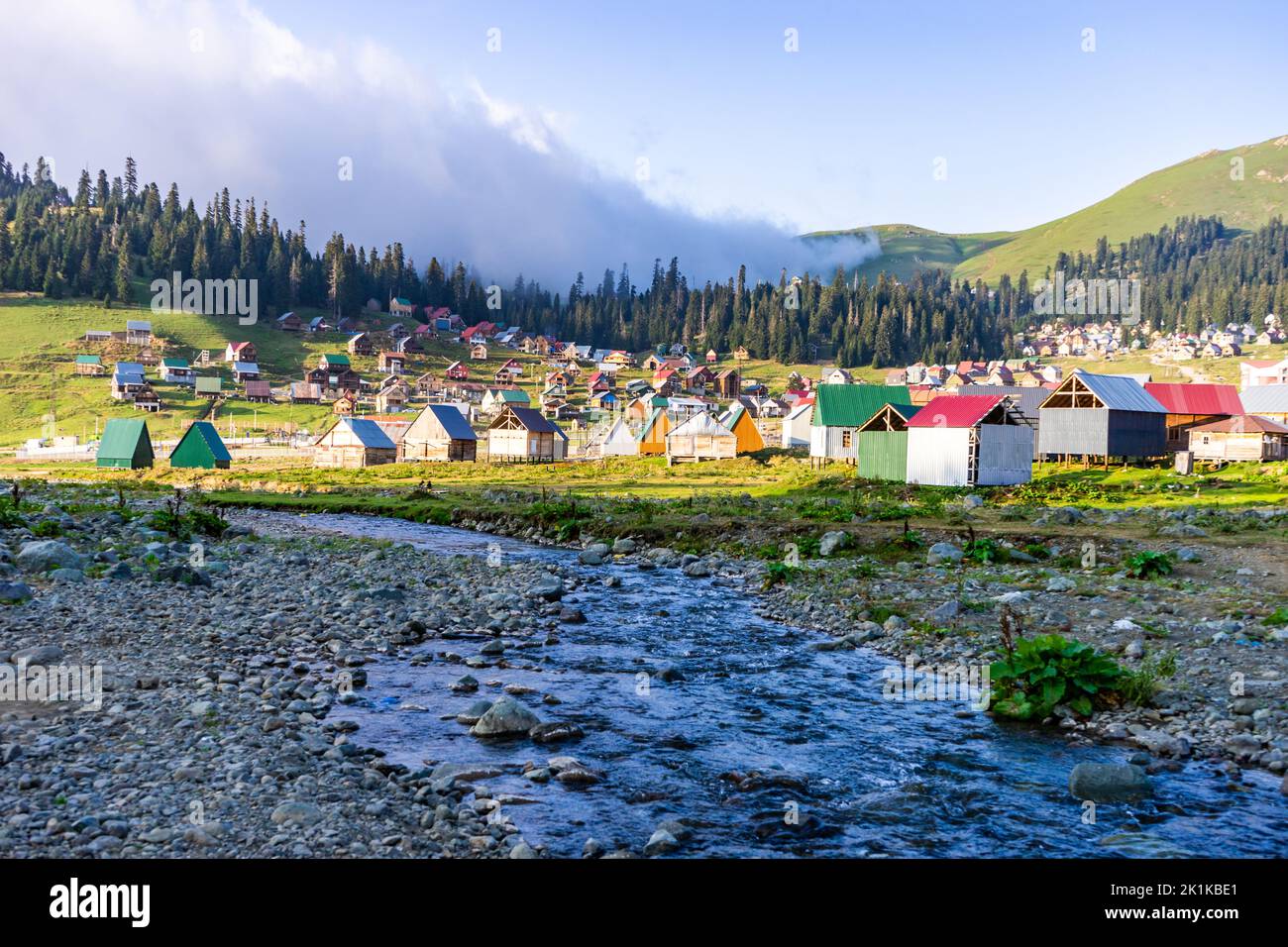 Traditional village houses  in the Caucasus mountains by a river, Bakhmaro, Chokhatauri, Guria, Georgia Stock Photo