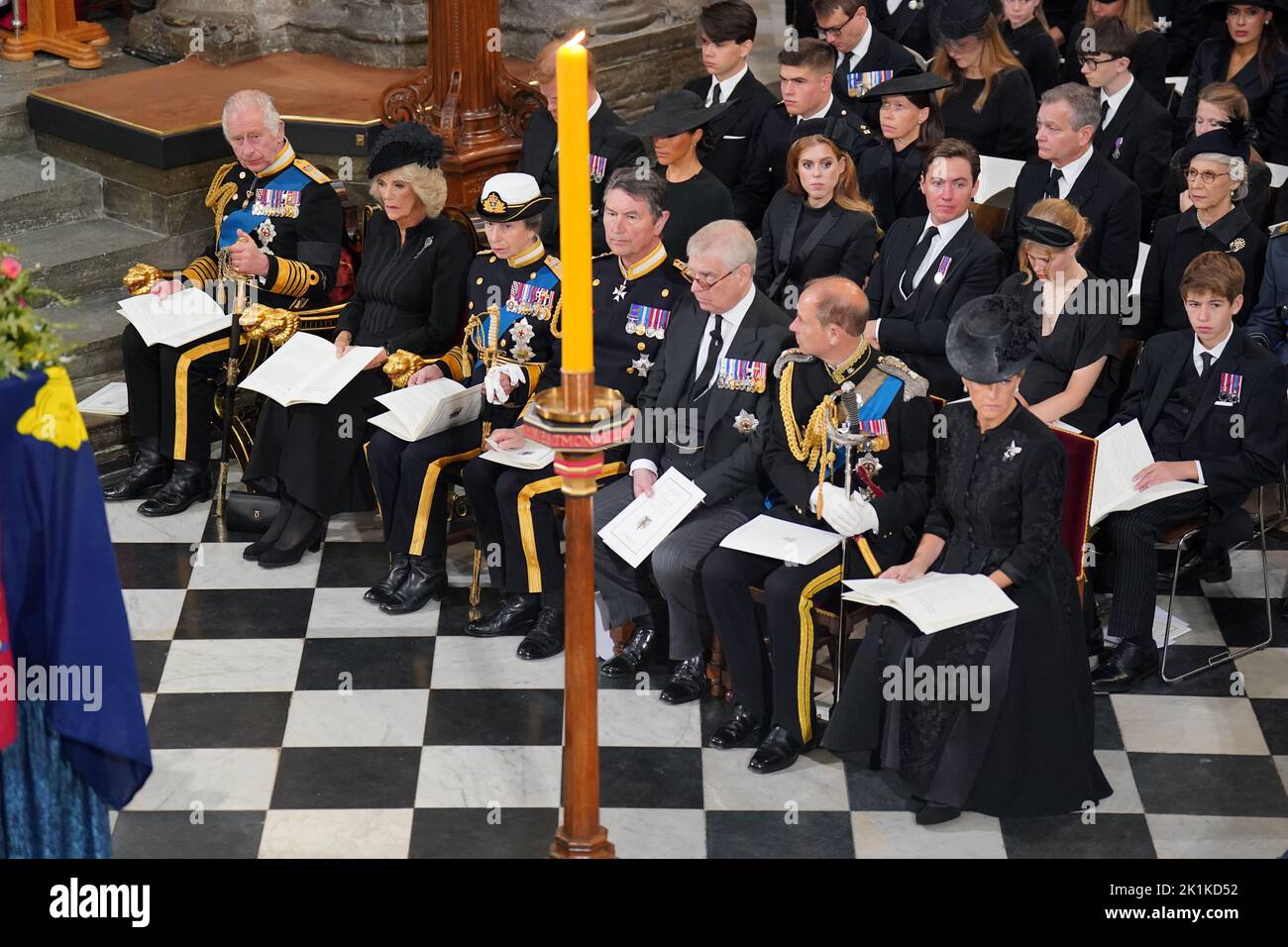 (front row) King Charles III, the Queen Consort, the Princess Royal, Vice Admiral Sir Tim Laurence, the Duke of York, the Earl of Wessex, the Countess of Wessex, (second row) the Duke of Sussex, the Duchess of Sussex, Princess Beatrice, Edoardo Mapelli Mozzi and Lady Louise Windsor and James, Viscount Severn, and (third row) Samuel Chatto, Arthur Chatto, Lady Sarah Chatto, Daniel Chatto and the Duchess of Gloucester in front of the coffin of Queen Elizabeth II during her State Funeral at the Abbey in London. Picture date: Monday September 19, 2022. Stock Photo