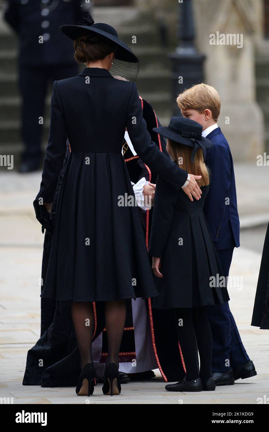 the Princess of Wales (left), Prince George (right) and Princess Charlotte arriving at the State Funeral of Queen Elizabeth II, held at Westminster Abbey, London. Picture date: Monday September 19, 2022. Stock Photo