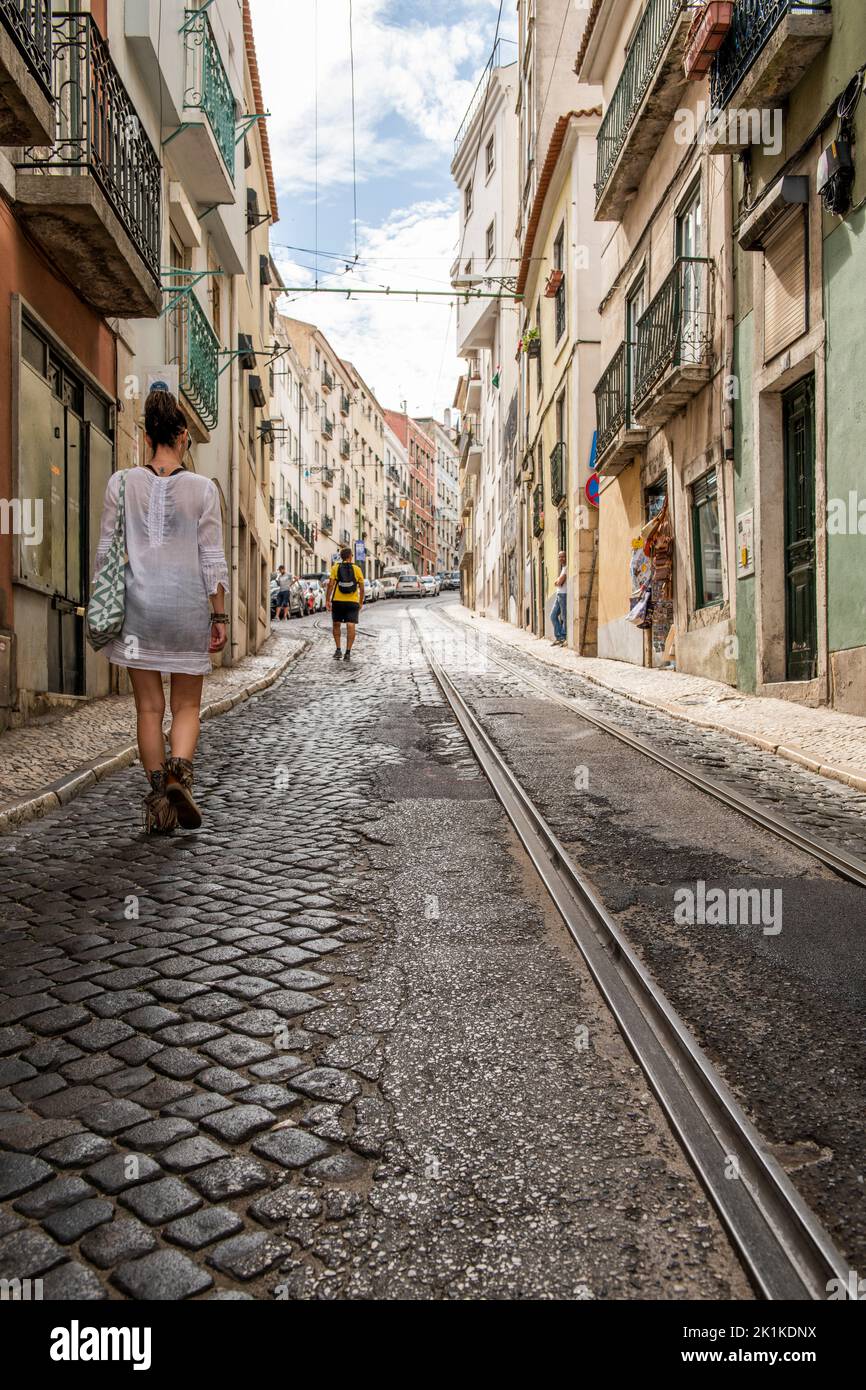 Walking through the streets of Lisbon along the tram tracks in the Republic of Portugal Stock Photo