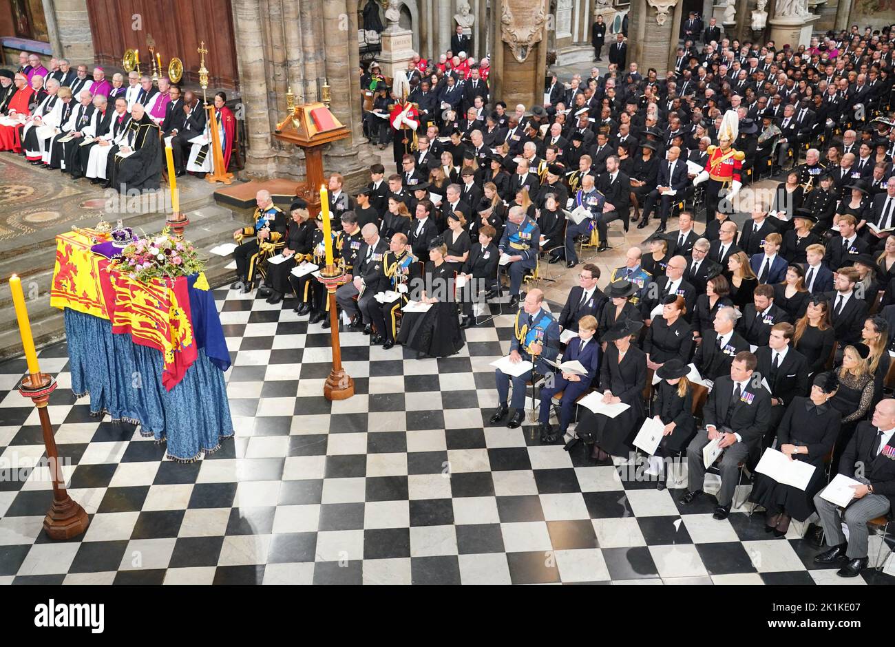 (front row) King Charles III, the Queen Consort, the Princess Royal, Vice Admiral Sir Tim Laurence, the Duke of York, the Earl of Wessex, the Countess of Wessex, the Prince of Wales, Prince George, the Princess of Wales, Princess Charlotte, Peter Phillips, Zara Tindall and Mike Tindall in front of the coffin of Queen Elizabeth II during her State Funeral at the Abbey in London. Picture date: Monday September 19, 2022. Stock Photo