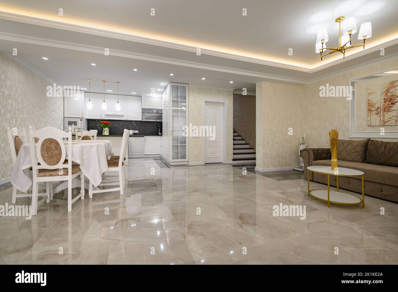 Huge luxurious home studio kitchen with marble floor Stock Photo