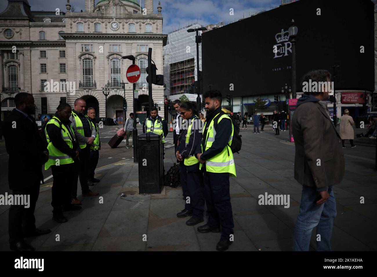 People observe the minute of silence on the day of the state funeral and burial of Britain's Queen Elizabeth, in London, Britain, September 19, 2022.  REUTERS/Carlos Barria Stock Photo