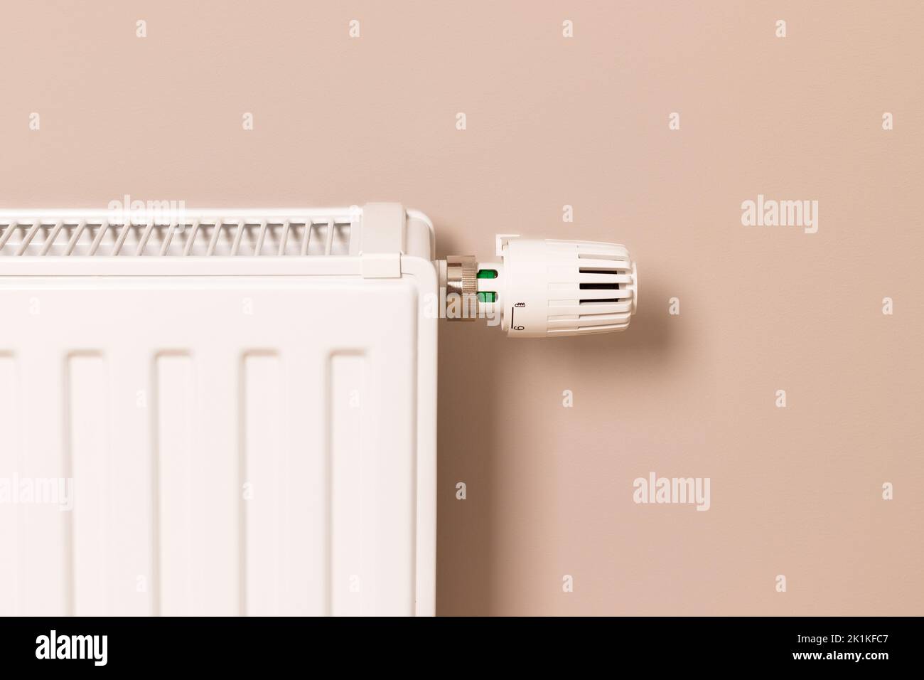 Home heating radiator in modern living room. Creating and keeping