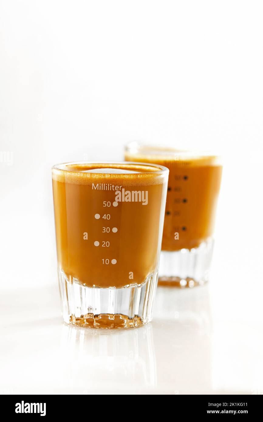 Two shots of coffee with milk Stock Photo Alamy