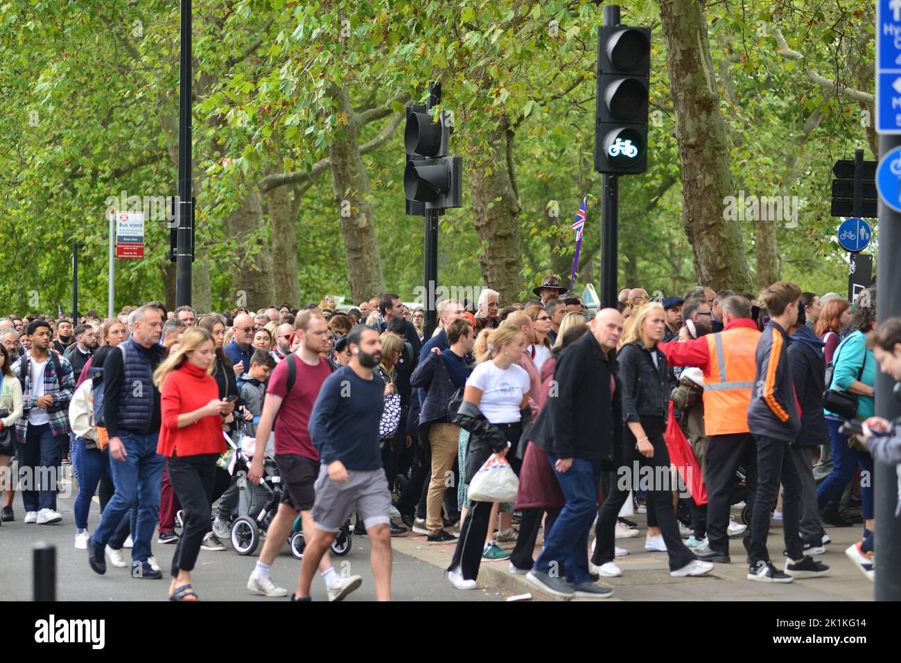 State funeral of Her Majesty Queen Elizabeth II, London, UK, Monday 19th September 2022. Crowds of people pouring into Hyde Park from Park Lane to watch the public screening on big screens. Stock Photo