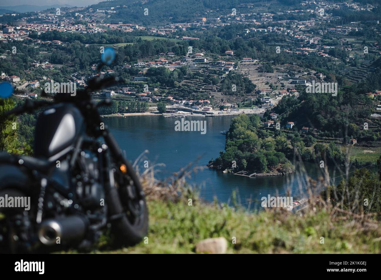 View of the Douro River, in the Douro Valley, Porto, Portugal. In the foreground is a blurred tourist motorcycle. Stock Photo