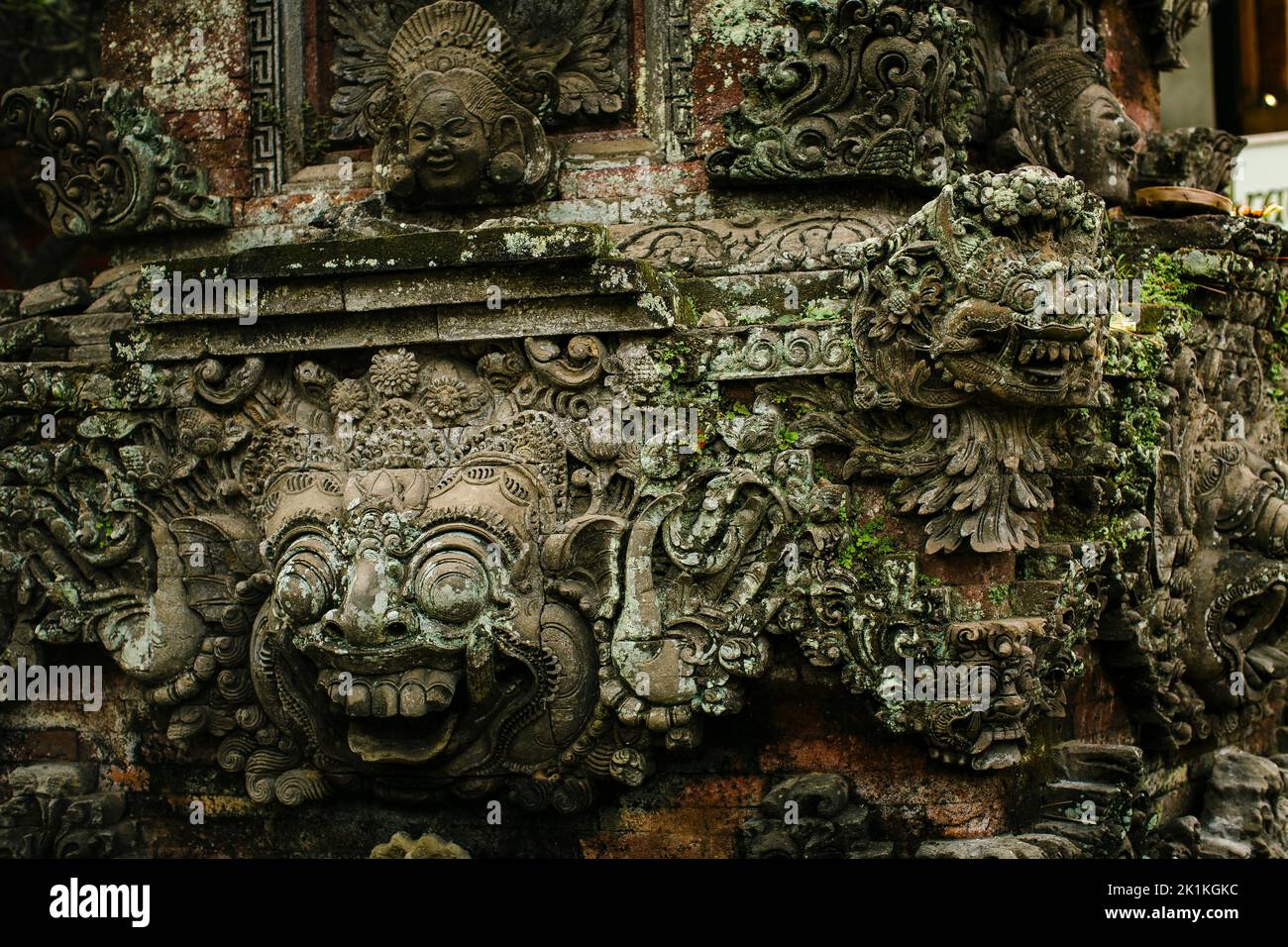 A traditional demons carved in stone on the island of Bali, Indonesia. Stock Photo