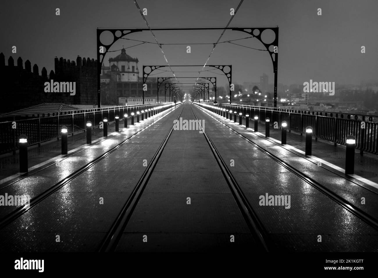 Night view of the Dom Luis I Bridge, Porto, Portugal. Black and white photo. Stock Photo
