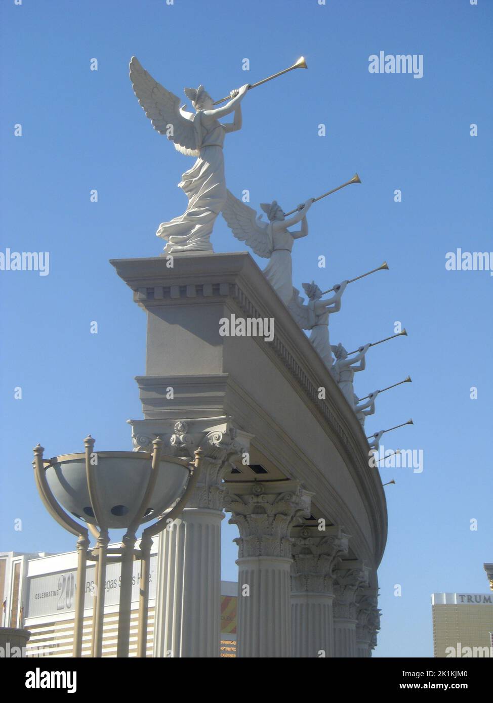 The vertical view of angels over the columns under the blue sky ...