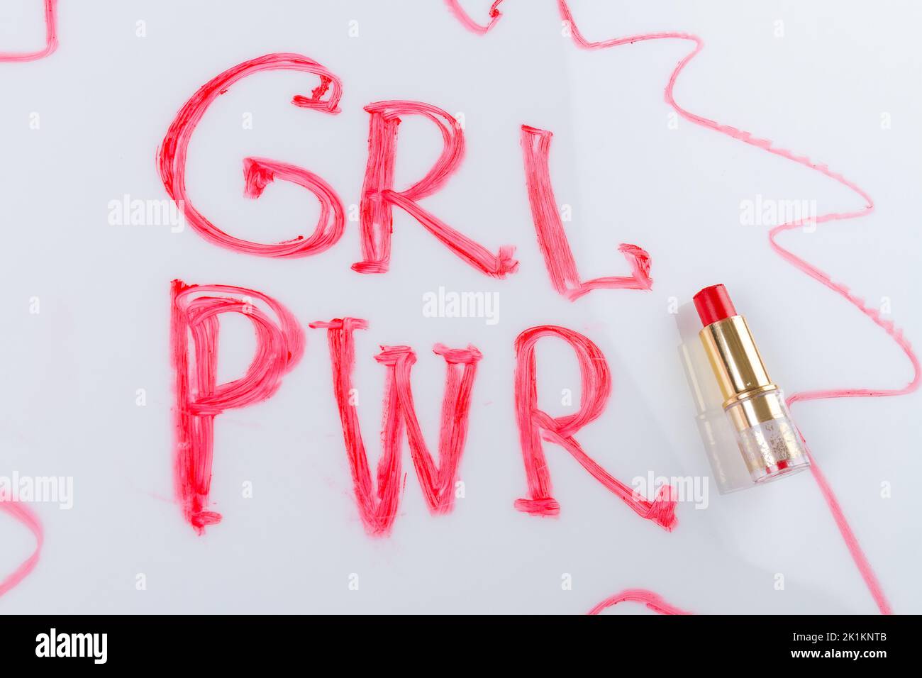 Grl pwr incription and red lipstick isolated on white background. Girl power concept. Stock Photo