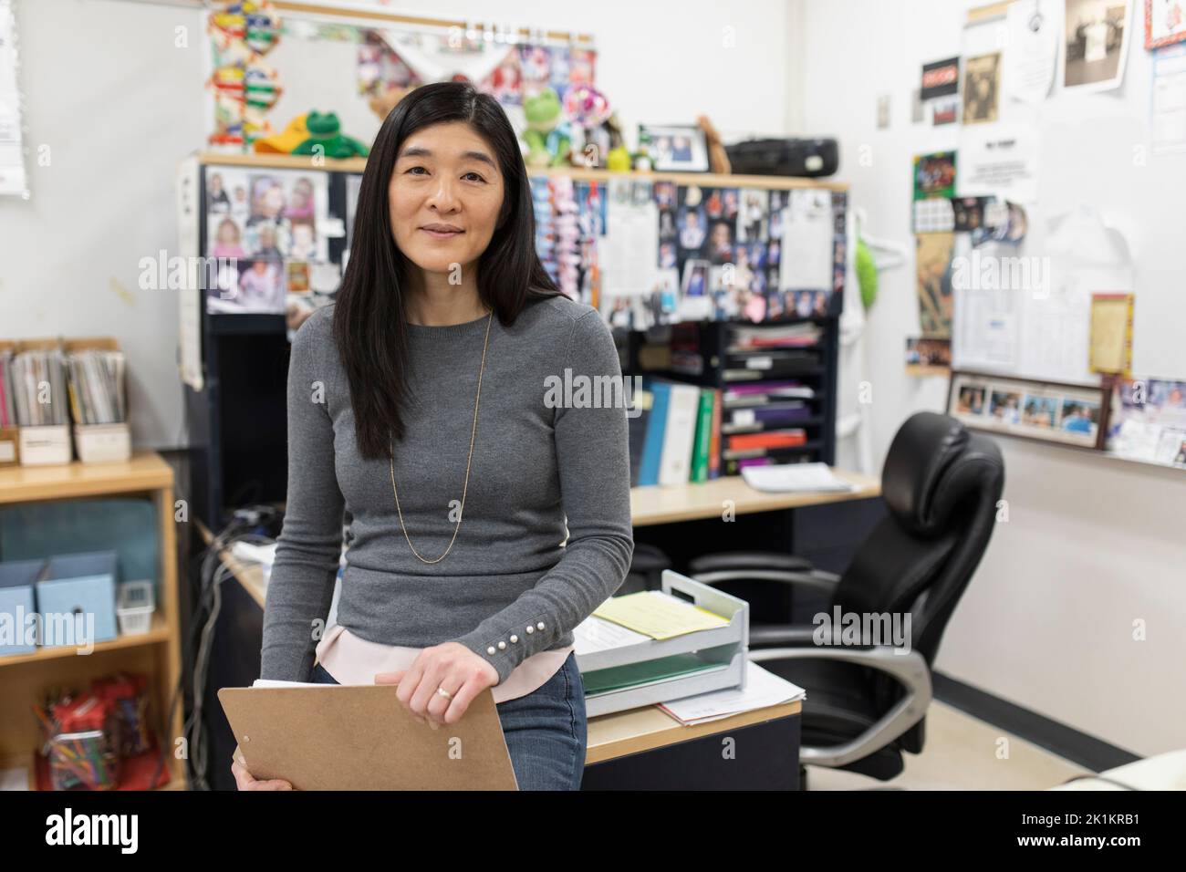 Female asian teacher in classroom hi-res stock photography and images ...