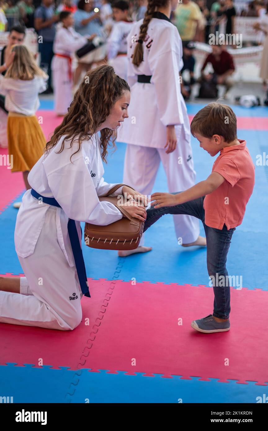 Children trying Tae Kwon Do at Sports Day multi-sports street event in Plaza del Pilar, Zaragoza, Spain Stock Photo