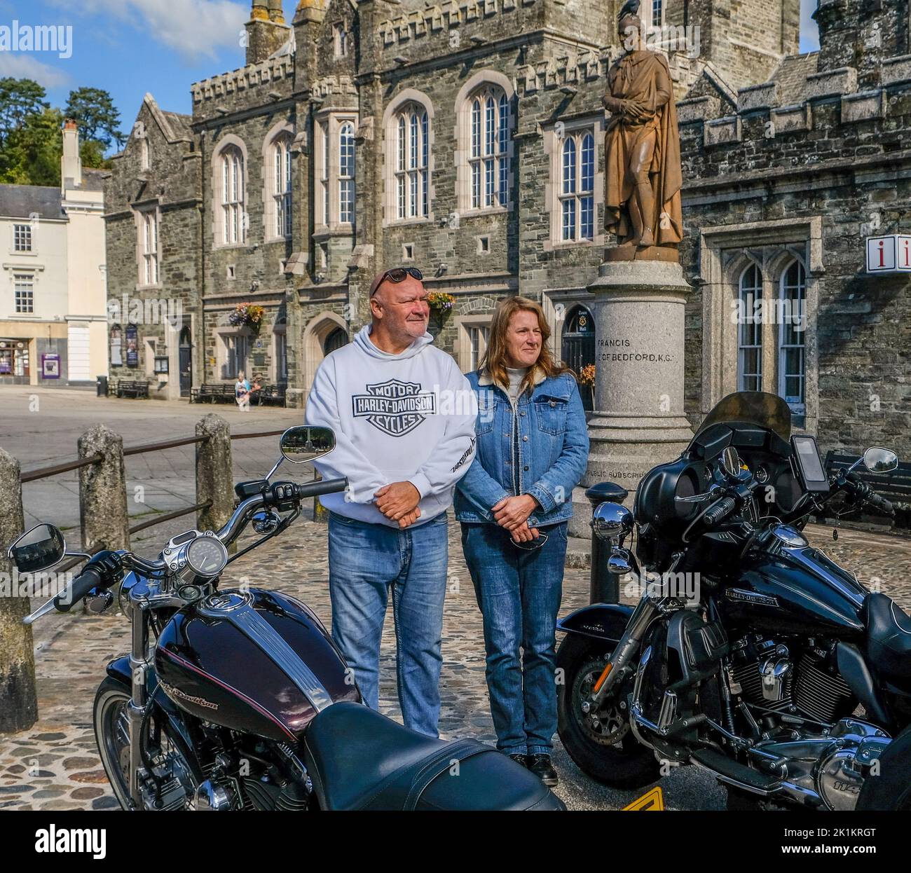 Devon, UK. 19th Sep, 2022. Two minutes silence for HRH Queen Elizabeth II, Tavistock  Devon UK. Two Harley Davidson Bikers show their respect and stand for 2 minutes silence next to their Harley Davidson Motor Cycles.in Tavistock Devon. In the background is a statue of Sir Francis Drake, famous son of Tavistock. Credit: charlie bryan/Alamy Live News Stock Photo