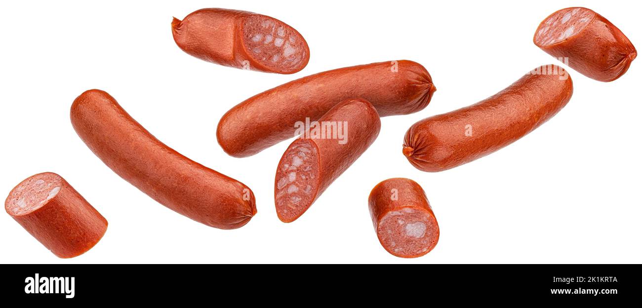 Falling smoked sausages isolated on white background Stock Photo