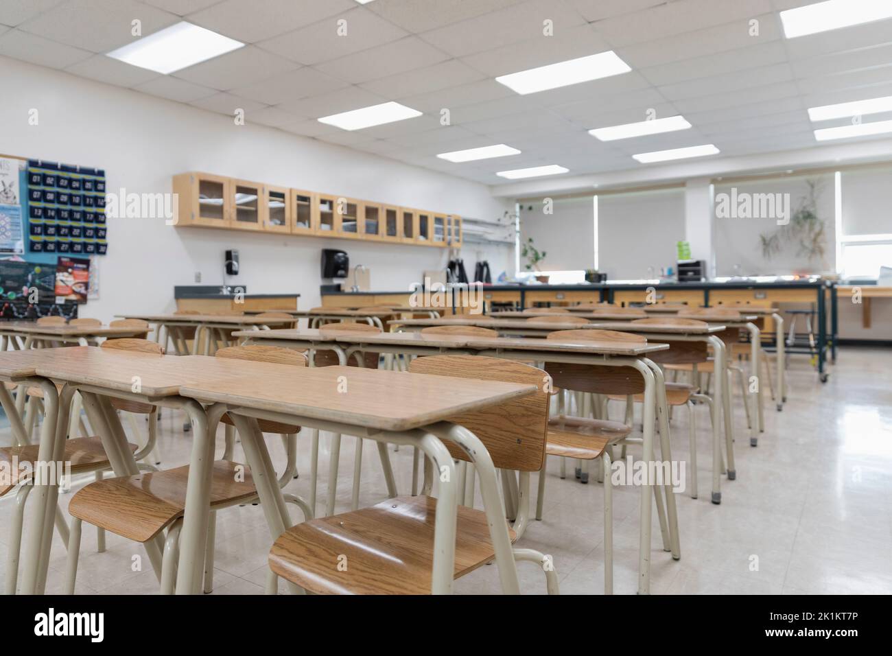 Desks in a row in empty high school classroom Stock Photo Alamy