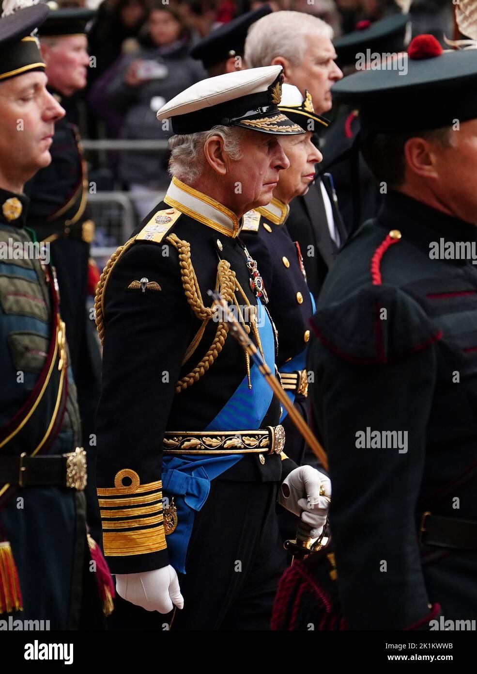 King Charles III and the Princes Royal walk down The Mall, central