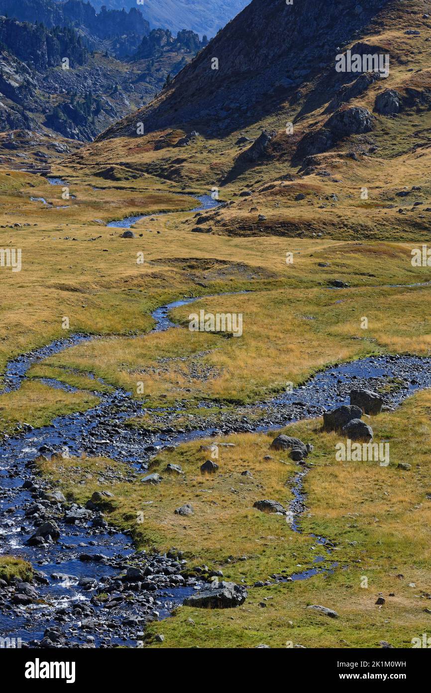 La Pra plateau creek and slopes of Belledonne mounatin range Stock Photo