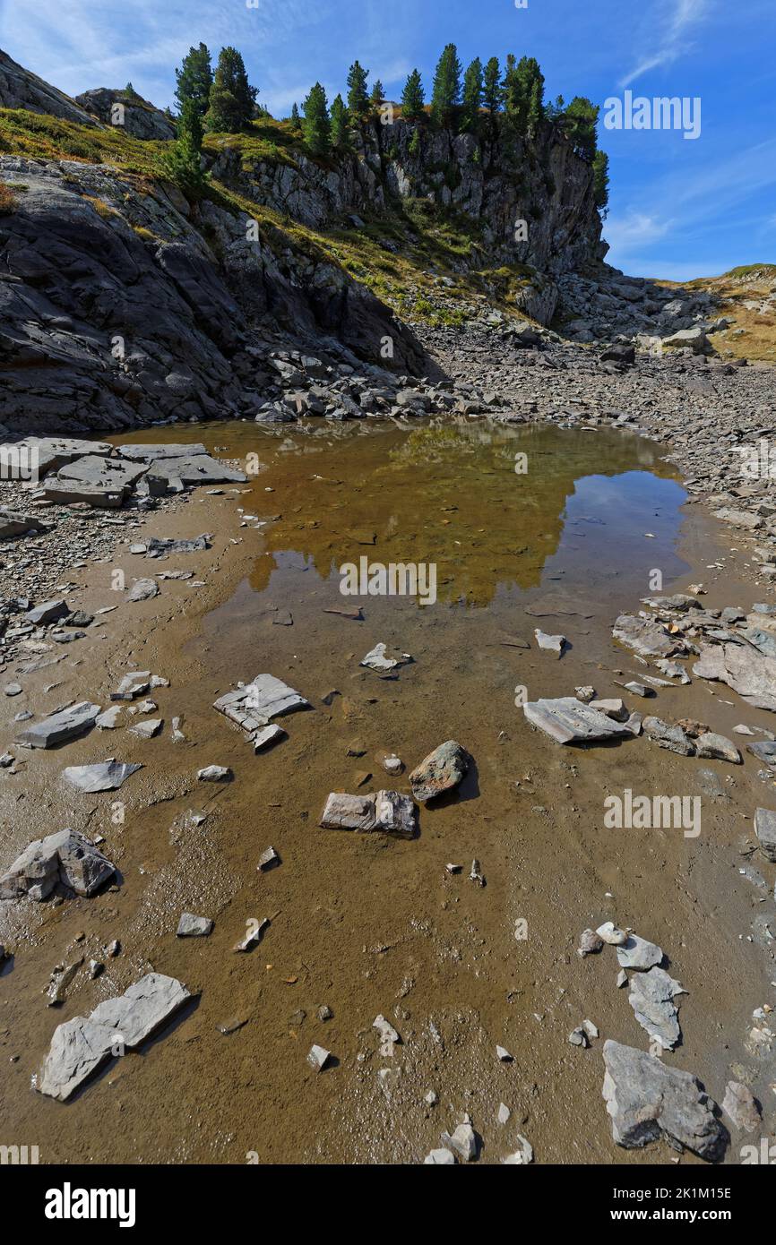 Almost dry lake in Belledonne moutain range Stock Photo