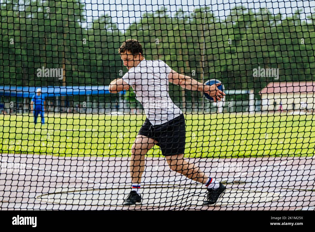 discus throwing attempt male athlete Stock Photo