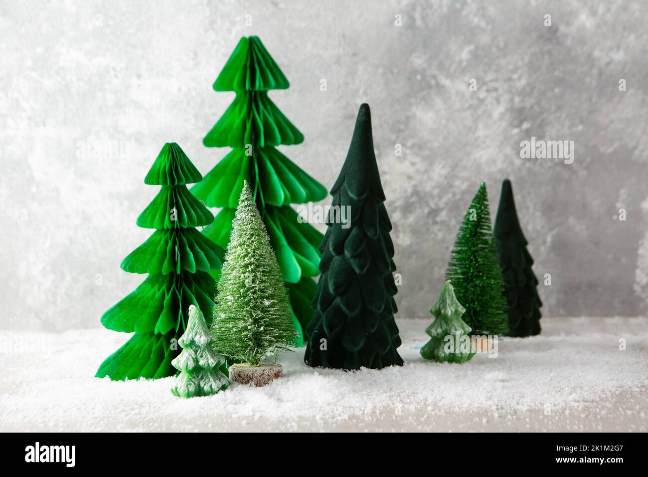 Green Chritmas tree decorations on light background holiday card snow Stock Photo