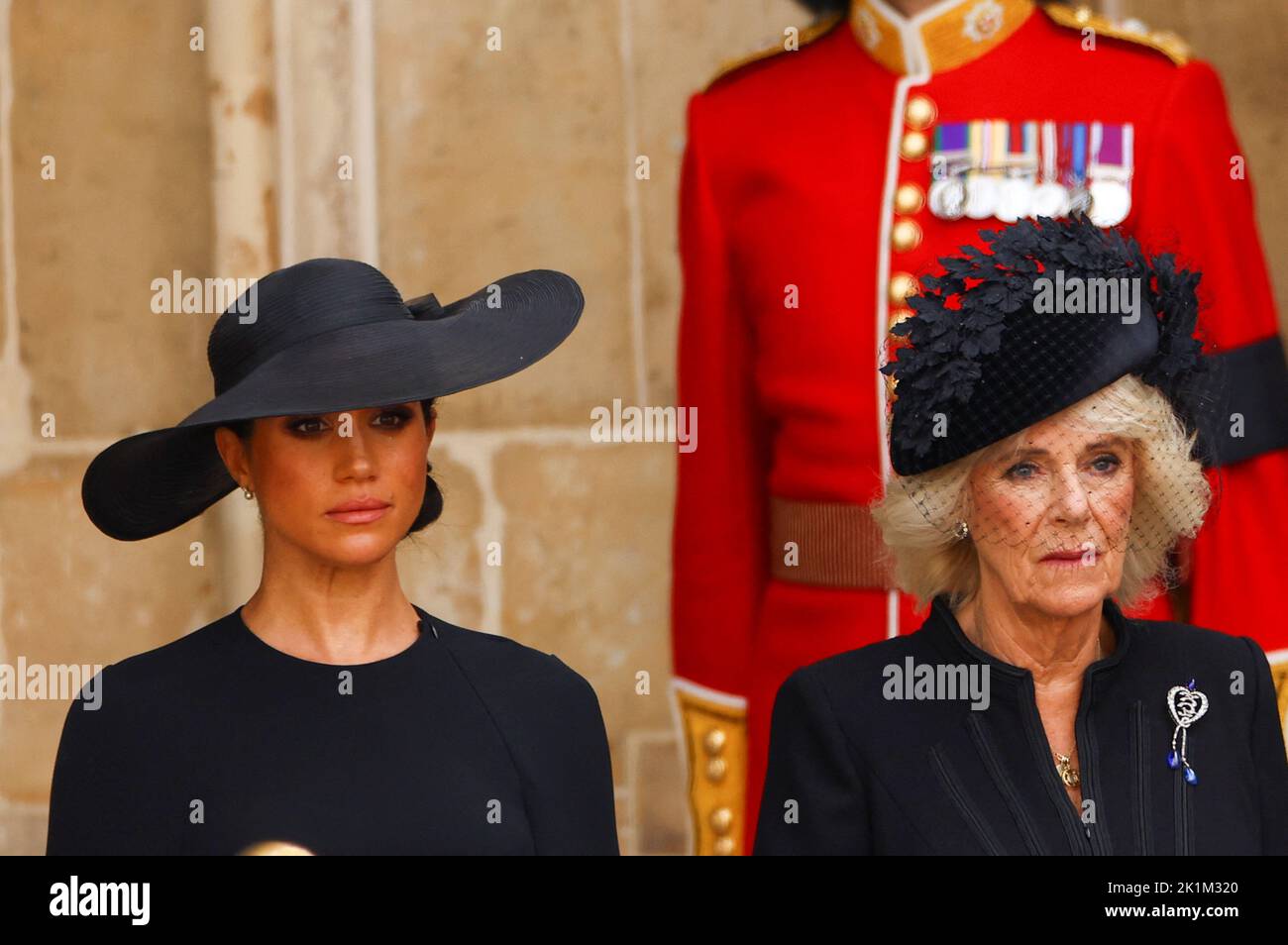 Britain's Meghan, Duchess of Sussex and Britain's Queen Camilla attend the state funeral and burial of Britain's Queen Elizabeth at Westminster Abbey, in London, Britain, September 19, 2022.  REUTERS/Kai Pfaffenbach Stock Photo